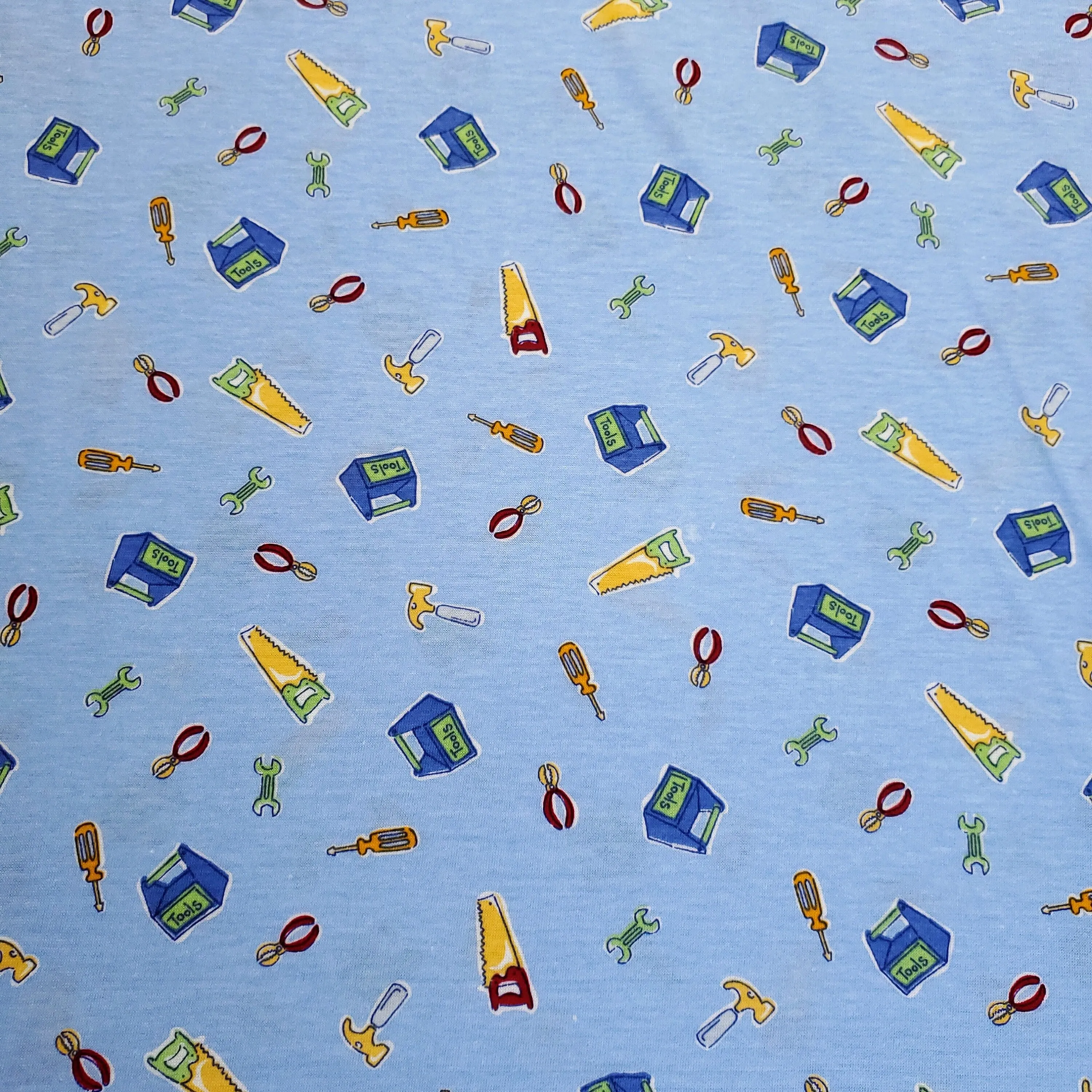 Cotton Blend Stretch Knit T-Shirt Fabric, Construction Tools on Blue, Great for T-shirts and more. 2-way stretch. Sold by the 1/2 yard